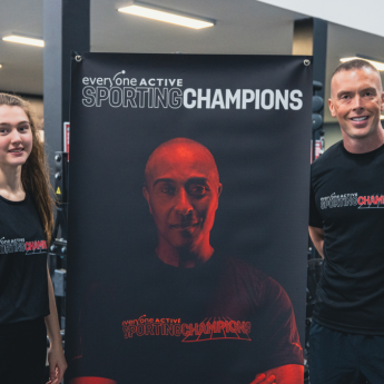Richard Kilty and young female athlete pose with Sporting champions banner to promote applications